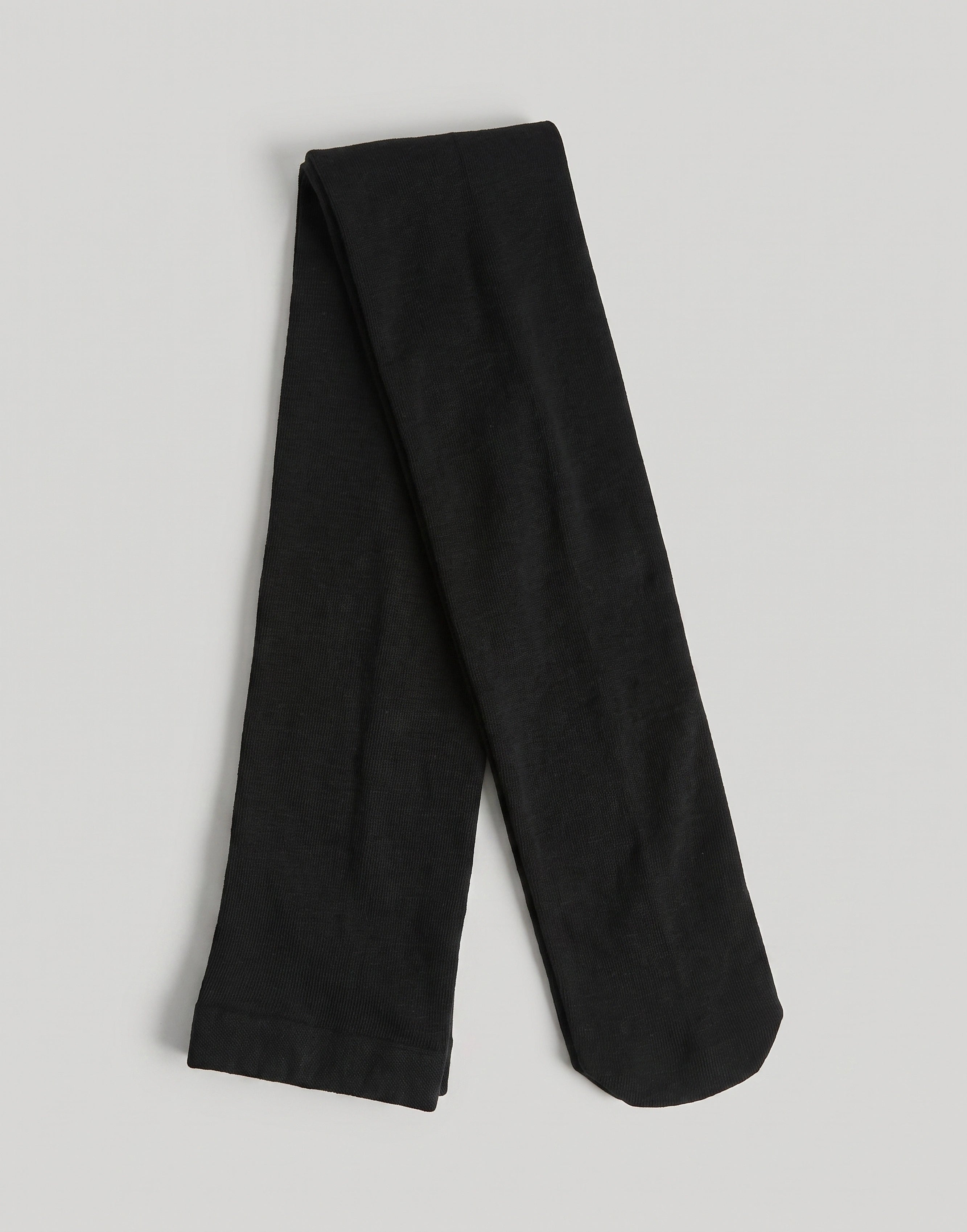 Black fine knit organic cotton tights made from GOTS-certified organic cotton.