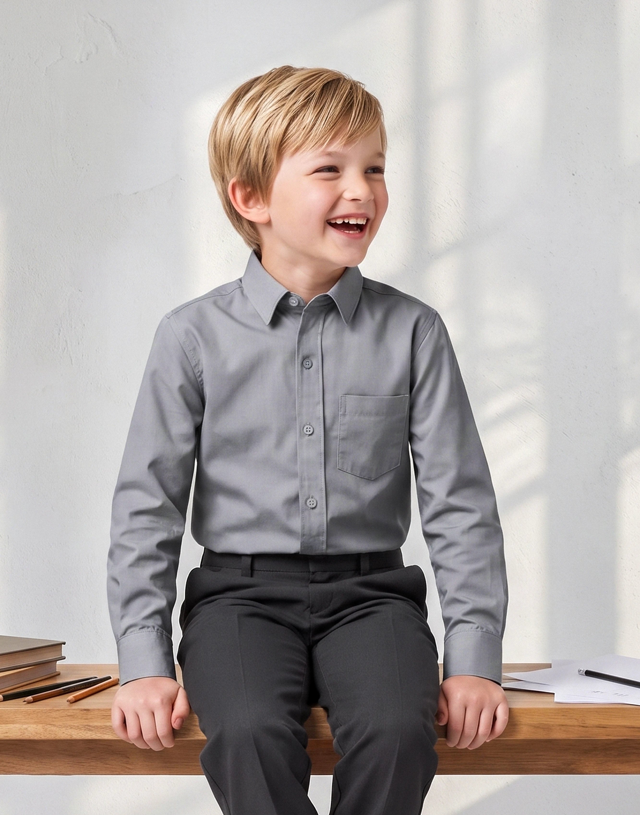 Child wearing a grey long sleeve organic cotton school shirt front view