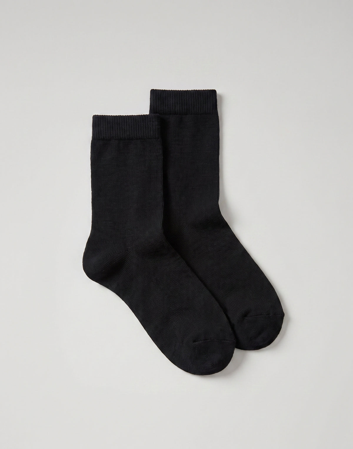 Black organic cotton ankle socks made from GOTS-certified organic cotton.