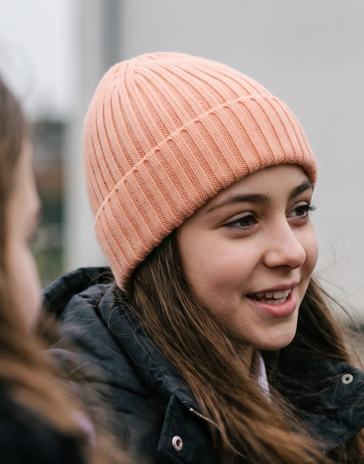 Children's organic cotton beanie hat in Peach made from GOTS-certified organic cotton.