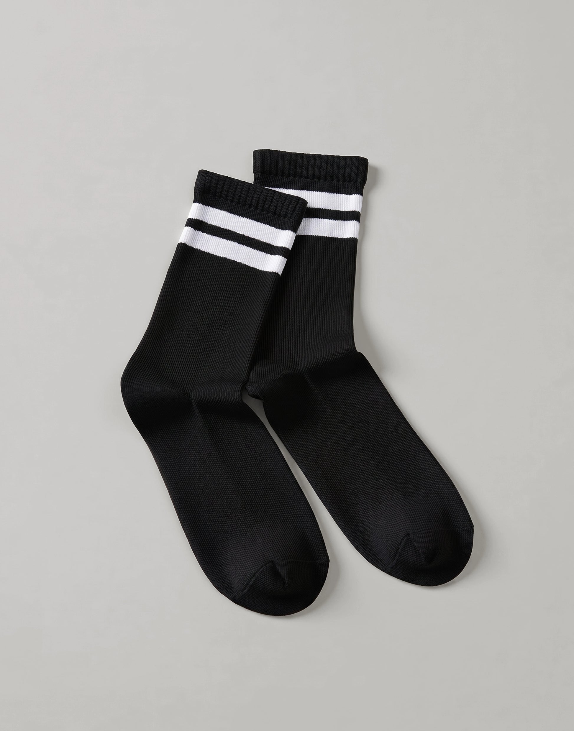 Black organic cotton sports socks made from GOTS-certified organic cotton with a cushioned terry sole.
